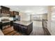 Modern kitchen with stainless steel appliances, granite countertops, and central island at 805 Grafton Peak Lane Ln, Apex, NC 27523