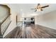 Open living area with hardwood floors that flow into a modern kitchen with an island at 805 Grafton Peak Lane Ln, Apex, NC 27523