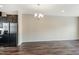 Open concept living area adjacent to the kitchen with hardwood floors at 805 Grafton Peak Lane Ln, Apex, NC 27523