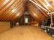 Large unfinished attic with exposed beams, small window at 816 Roanoke Dr, Cary, NC 27513
