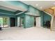 Bright and spacious carpeted basement with stairs, sliding glass doors, and a painted accent wall at 816 Roanoke Dr, Cary, NC 27513