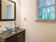 Modern bathroom with sleek vanity, bowl sink, and bright window at 816 Roanoke Dr, Cary, NC 27513
