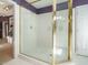 Bathroom featuring a large shower with glass doors and a gold frame at 816 Roanoke Dr, Cary, NC 27513