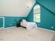Bedroom features high ceilings, and a bed under a unique window that provides ample natural light at 816 Roanoke Dr, Cary, NC 27513