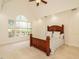Bright bedroom with vaulted ceiling, a large window, and a cozy bed for restful nights at 816 Roanoke Dr, Cary, NC 27513