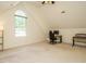 Bonus room with a large window, carpet flooring, and a built-in desk at 816 Roanoke Dr, Cary, NC 27513