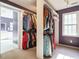 Bedroom closet includes rods for hanging clothing, white trim, and neutral carpet at 816 Roanoke Dr, Cary, NC 27513