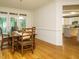 Dining area has a view of the kitchen with access to backyard and wood floors at 816 Roanoke Dr, Cary, NC 27513