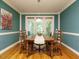 Charming dining room features a wood table, chairs, and doors to the deck at 816 Roanoke Dr, Cary, NC 27513