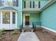 Charming home entrance with a well-manicured lawn, elegant plants, and a welcoming path at 816 Roanoke Dr, Cary, NC 27513