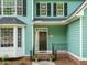 Inviting front porch with fresh landscaping and decorative planters welcome you home at 816 Roanoke Dr, Cary, NC 27513