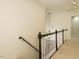 Hallway with white wainscoting, trim, and staircase at 816 Roanoke Dr, Cary, NC 27513