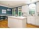 Kitchen with a center island, tile countertop, and a view of the outdoors at 816 Roanoke Dr, Cary, NC 27513
