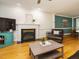Inviting living room with a fireplace, hardwood floors, and comfortable seating at 816 Roanoke Dr, Cary, NC 27513