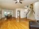 Open-concept living area with hardwood floors, staircase, and dining area for seamless entertaining at 816 Roanoke Dr, Cary, NC 27513