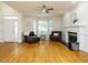 Inviting living room with hardwood floors, fireplace, and bay window offering abundant natural light at 816 Roanoke Dr, Cary, NC 27513