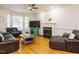 Comfortable living room with hardwood floors, fireplace, and plush leather seating at 816 Roanoke Dr, Cary, NC 27513