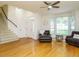 Spacious living room boasting gleaming hardwood floors, neutral paint and plenty of natural light at 816 Roanoke Dr, Cary, NC 27513