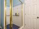 Walk-in shower with glass doors, white tile, and blue accents at 816 Roanoke Dr, Cary, NC 27513