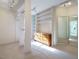 Spacious walk-in closet with built-in shelving, a dresser, and a large mirror for wardrobe organization at 816 Roanoke Dr, Cary, NC 27513