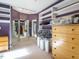 Spacious walk-in closet features ample shelving, mirrored doors, and a sunny carpeted floor at 816 Roanoke Dr, Cary, NC 27513