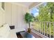 Relaxing outdoor balcony featuring comfortable seating, a glass table, and green tree views for serene outdoor living at 820 Laurel Gate Dr, Wake Forest, NC 27587