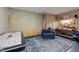 Basement featuring an air hockey table, lounge area, and workbench at 820 Laurel Gate Dr, Wake Forest, NC 27587