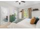 Bright bedroom with a ceiling fan, beige carpet, and a nice view from the sliding glass door at 820 Laurel Gate Dr, Wake Forest, NC 27587