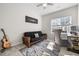 Comfortable bedroom features a futon, guitar, area rug, and natural light at 820 Laurel Gate Dr, Wake Forest, NC 27587