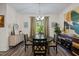 Elegant dining room features a round table with a stylish sideboard, creating a welcoming space for gatherings at 820 Laurel Gate Dr, Wake Forest, NC 27587
