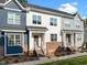 Attractive townhome showcases modern design with a welcoming porch and well-kept landscaping at 820 Laurel Gate Dr, Wake Forest, NC 27587