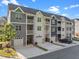 View of newly constructed townhomes with garage parking, covered balconies and sidewalks at 820 Laurel Gate Dr, Wake Forest, NC 27587
