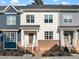 Townhouse with modern design, featuring brick accents, neutral siding, and well-kept landscaping at 820 Laurel Gate Dr, Wake Forest, NC 27587