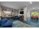 Finished garage with work area, tool storage, television, and a car parked inside with the garage door open at 820 Laurel Gate Dr, Wake Forest, NC 27587