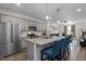 Open kitchen view connecting to a cozy living area, equipped with granite countertops and stainless appliances at 820 Laurel Gate Dr, Wake Forest, NC 27587