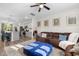 Open-concept living area with kitchen view, featuring a large sofa and bright natural light at 820 Laurel Gate Dr, Wake Forest, NC 27587