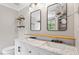 Modern bathroom featuring double sinks, a sleek vanity, and stylish fixtures at 8408 Haines Creek Ln, Raleigh, NC 27616