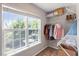 Walk-in closet with a large window providing natural light and ample storage space at 8408 Haines Creek Ln, Raleigh, NC 27616