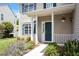 Charming front porch with decorative plants, stylish number art and green front door at 8408 Haines Creek Ln, Raleigh, NC 27616