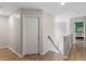 Upstairs hallway with staircase showcasing the interior features of the home at 8408 Haines Creek Ln, Raleigh, NC 27616