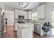 Modern kitchen with granite countertops, stainless steel appliances, and an island with barstool seating at 8408 Haines Creek Ln, Raleigh, NC 27616