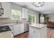 Kitchen featuring granite countertops, white cabinets, and stainless steel appliances at 8408 Haines Creek Ln, Raleigh, NC 27616