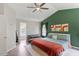 Stylish main bedroom features vaulted ceiling and hardwood floors with a comfortable sitting area at 8408 Haines Creek Ln, Raleigh, NC 27616