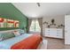 Spacious main bedroom featuring hardwood floors, modern color scheme, and natural light at 8408 Haines Creek Ln, Raleigh, NC 27616