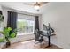 Bright office space featuring a ceiling fan, natural light, and hardwood flooring at 8408 Haines Creek Ln, Raleigh, NC 27616