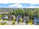 Aerial shot of a neighborhood showcasing well-maintained homes and lush green landscaping at 846 Lake Artesia Ln, Fuquay Varina, NC 27526