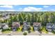 Aerial view of a residential area featuring neatly arranged homes with lush green trees at 846 Lake Artesia Ln, Fuquay Varina, NC 27526