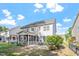 Inviting backyard features a screened porch with an outdoor dining area at 846 Lake Artesia Ln, Fuquay Varina, NC 27526