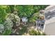 Expansive backyard with lush greenery, playhouse, patio, and screened in porch perfect for entertaining at 846 Lake Artesia Ln, Fuquay Varina, NC 27526