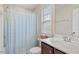 Cozy bathroom with a toilet, tub and shower combination, a sink, and a window for natural light at 846 Lake Artesia Ln, Fuquay Varina, NC 27526